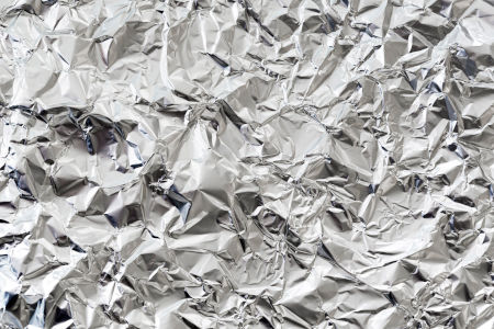 a close-up shot of a wrinkled sheet of aluminum